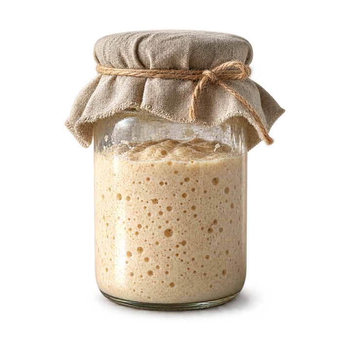 Active sourdough starter in a glass jar